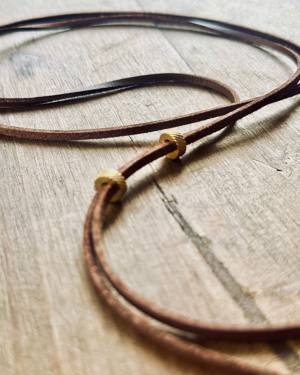 Cognac-colored vegan leather strap, embellished with stainless steel beads. Wild, sensual, natural.